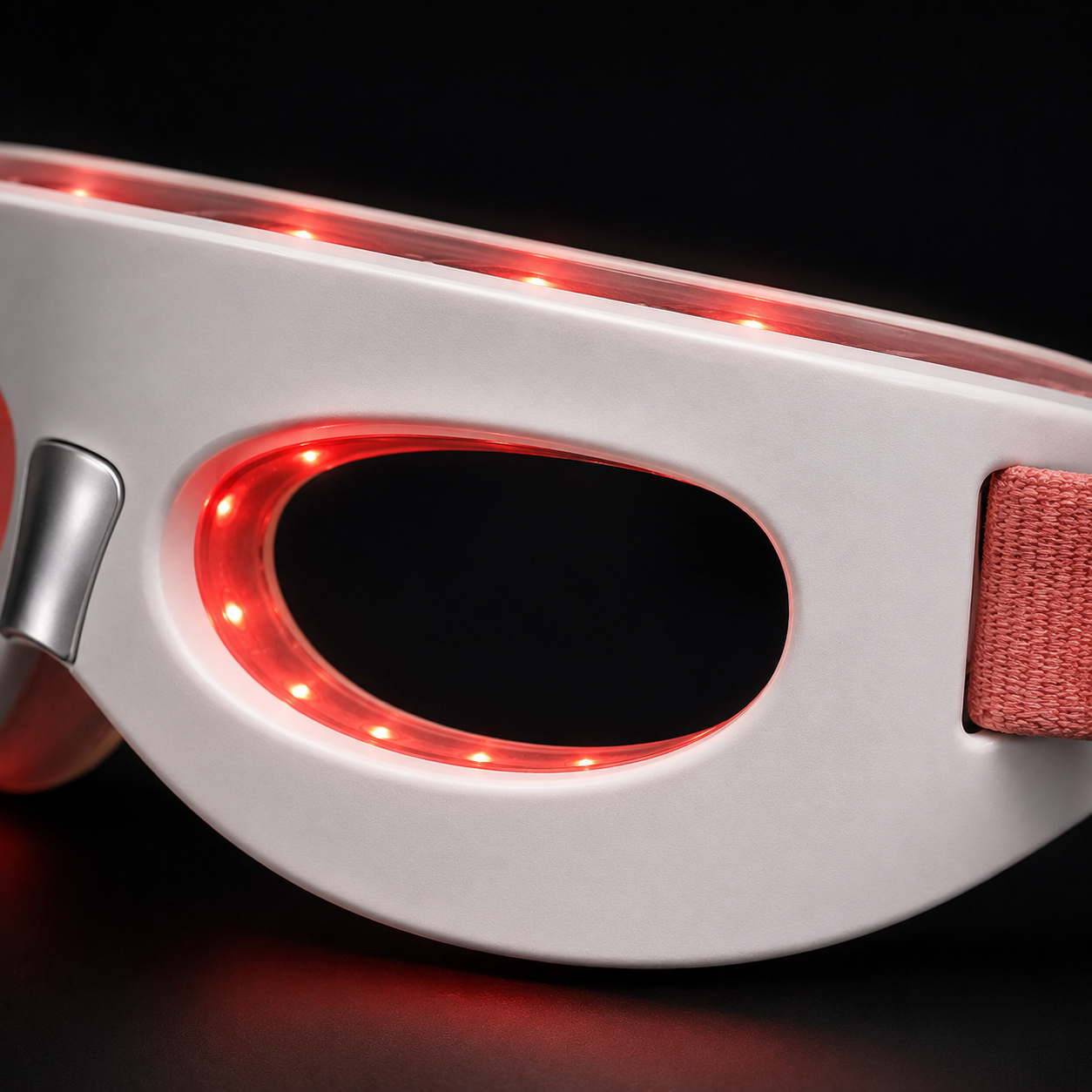 Close-up of PHŌRMA Vista Light's red LED ring lit around the open eye opening