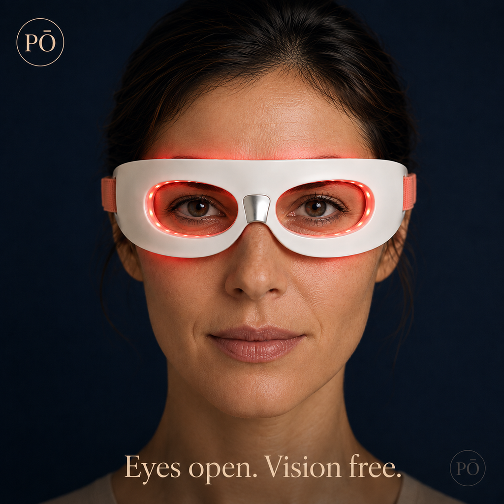 Woman wearing PHŌRMA Vista Light red light glasses with LEDs glowing around both eyes, eyes open and visible