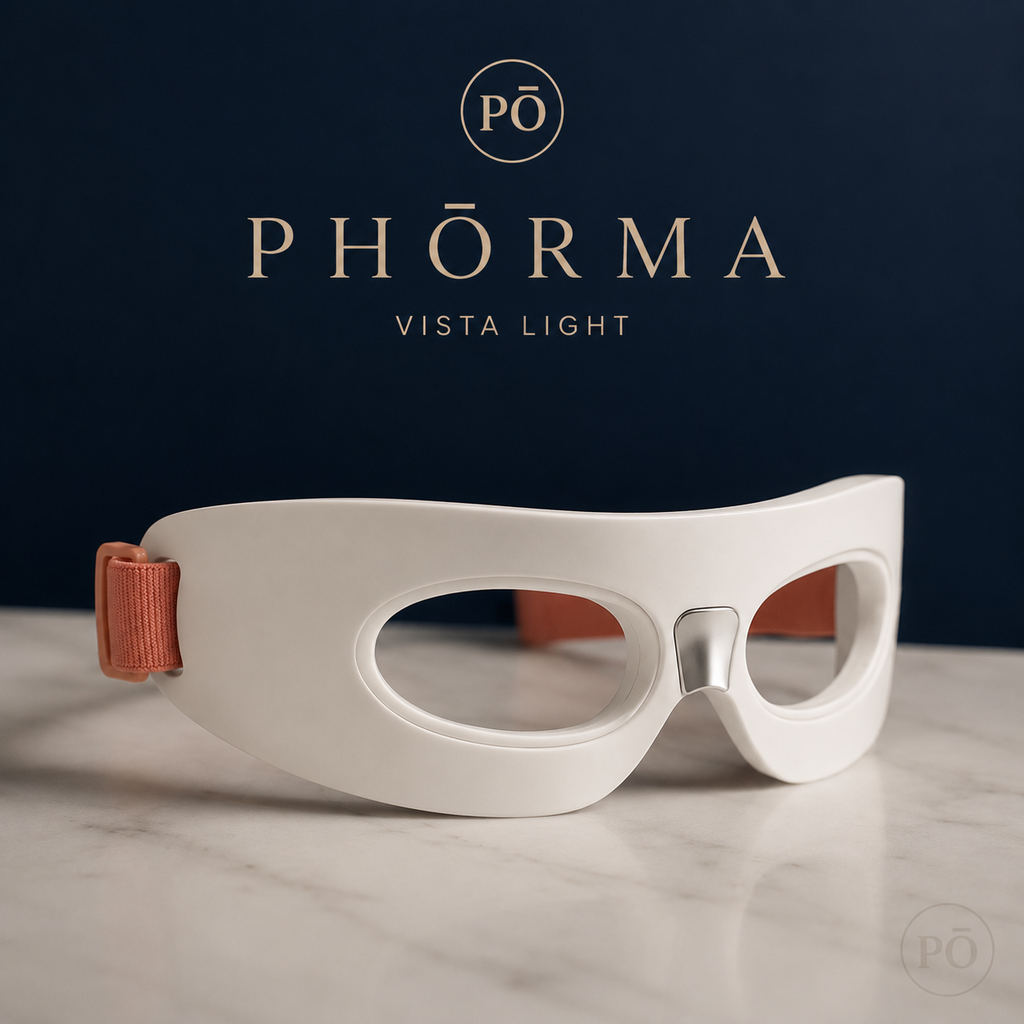 PHŌRMA Vista Light red light therapy eye mask – premium wellness device on marble surface